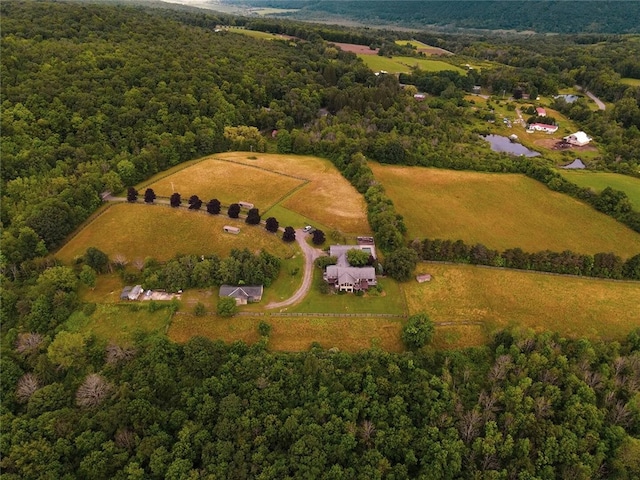 bird's eye view featuring a wooded view