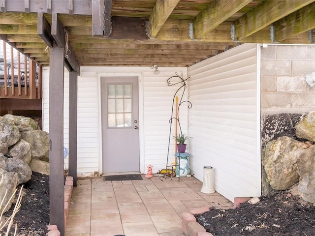 entrance to property featuring a patio