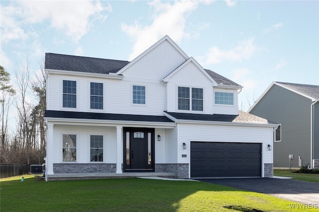 modern farmhouse style home with driveway, cooling unit, a front lawn, and board and batten siding