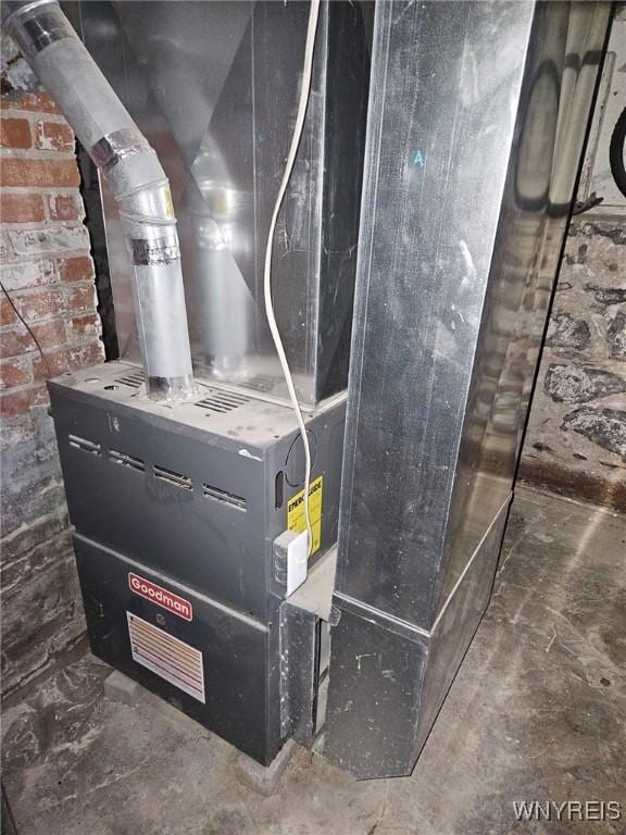 utility room featuring heating unit