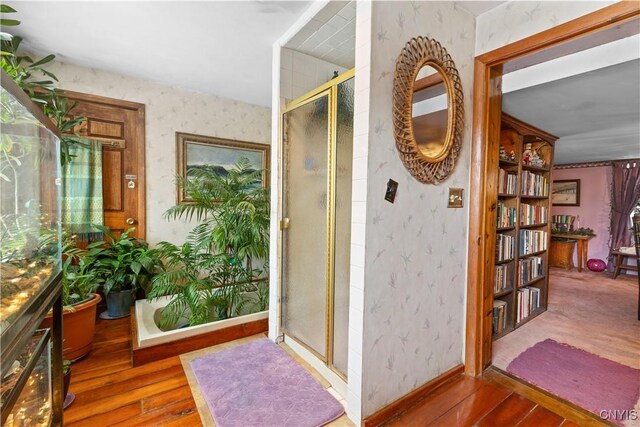 225 Amberg Rd, Ohio, NY 13324 - full bathroom with wallpapered walls, hardwood / wood-style floors, and a shower stall