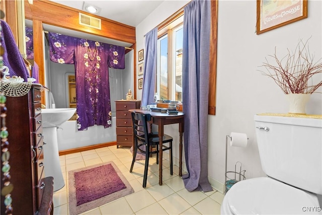 225 Amberg Rd, Ohio, NY 13324 - bathroom with toilet, baseboards, and tile patterned flooring