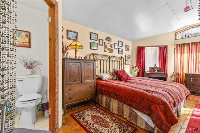 bedroom featuring vaulted ceiling