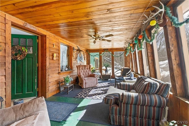 sunroom with wood ceiling and ceiling fan