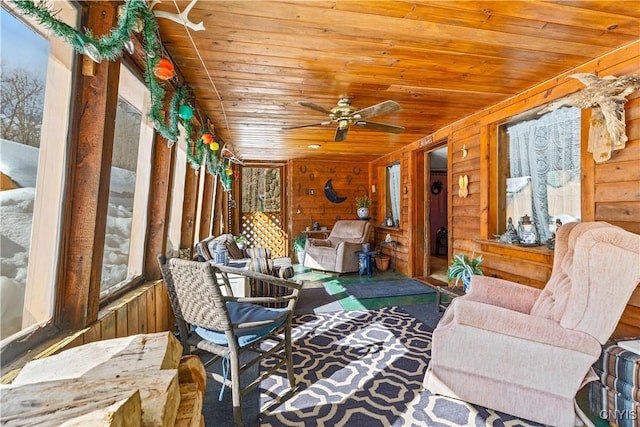 sunroom with wood ceiling and ceiling fan