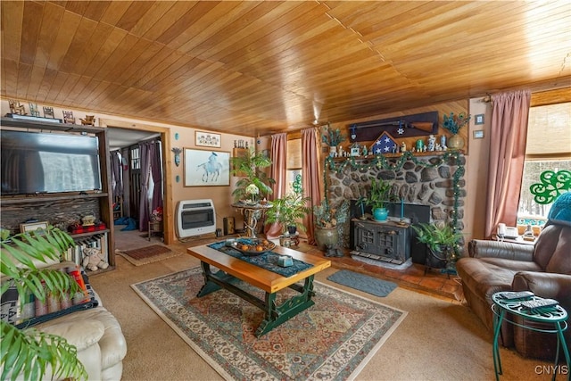 living area featuring carpet floors, wood ceiling, a wood stove, and heating unit