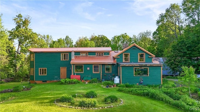 225 Amberg Rd, Ohio, NY 13324 - rear view of house with a lawn, a chimney, metal roof, and view of wooded area