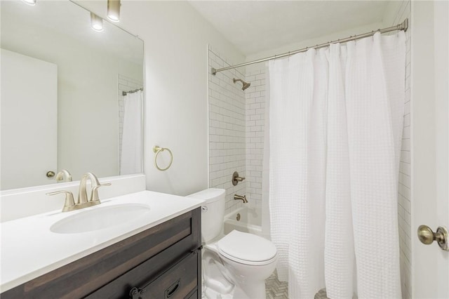 bathroom with toilet, shower / tub combo, and vanity