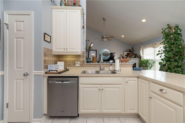 kitchen with a sink, ceiling fan, light countertops, and stainless steel dishwasher