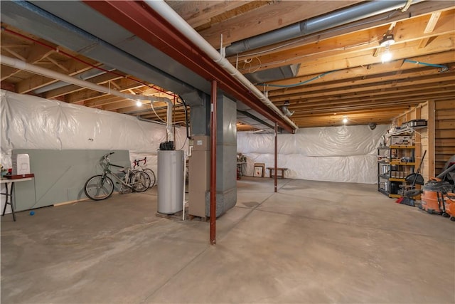 unfinished basement with heating unit and gas water heater