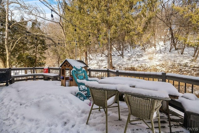 view of snow covered deck