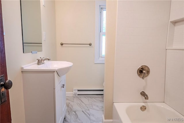 bathroom featuring marble finish floor, plenty of natural light, a baseboard heating unit, and vanity