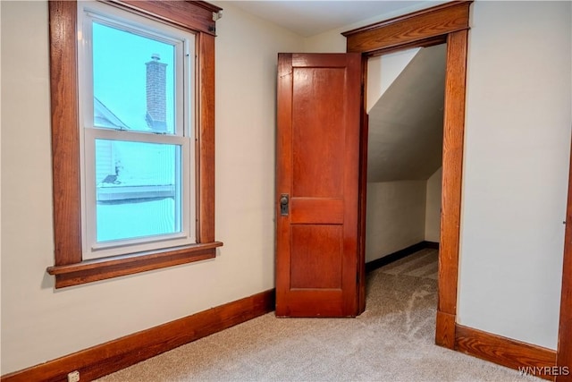 interior space with carpet floors and baseboards