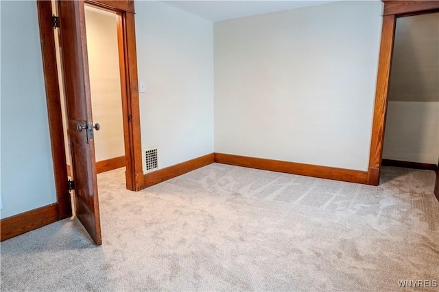 interior space featuring carpet floors, baseboards, and visible vents