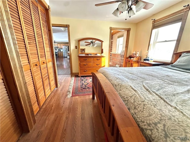 bedroom featuring ceiling fan and wood finished floors