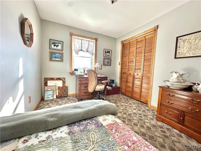 interior space with a closet and baseboards