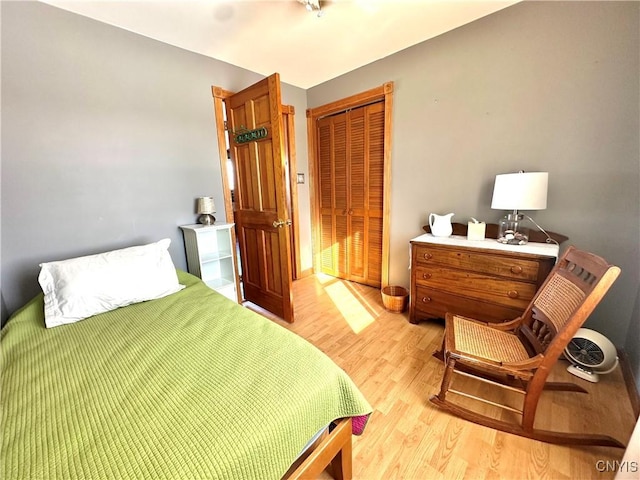 bedroom with a closet and light wood-style floors