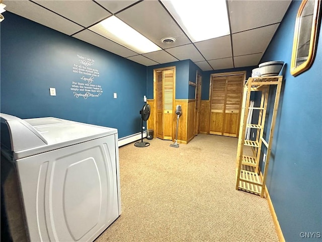 washroom featuring laundry area, visible vents, baseboard heating, carpet, and washing machine and clothes dryer