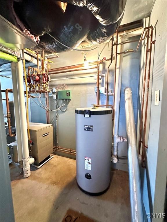 utility room featuring water heater