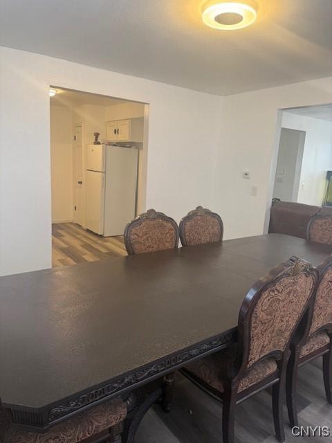 dining room with light wood-style flooring