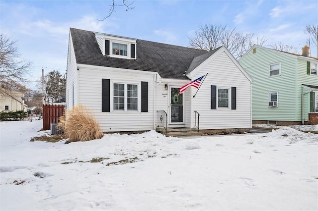 view of front of property with a shingled roof and cooling unit