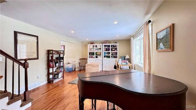 office space with recessed lighting, light wood-type flooring, visible vents, and baseboards