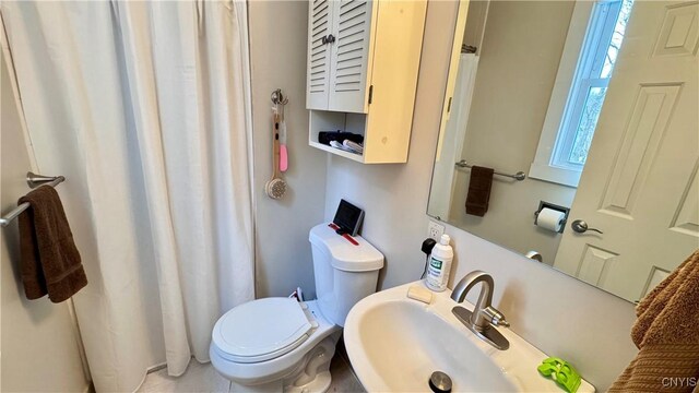 full bath with a sink and toilet