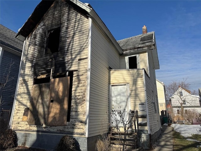 view of property exterior featuring entry steps