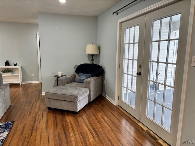 living area featuring french doors, recessed lighting, visible vents, dark wood-type flooring, and baseboards