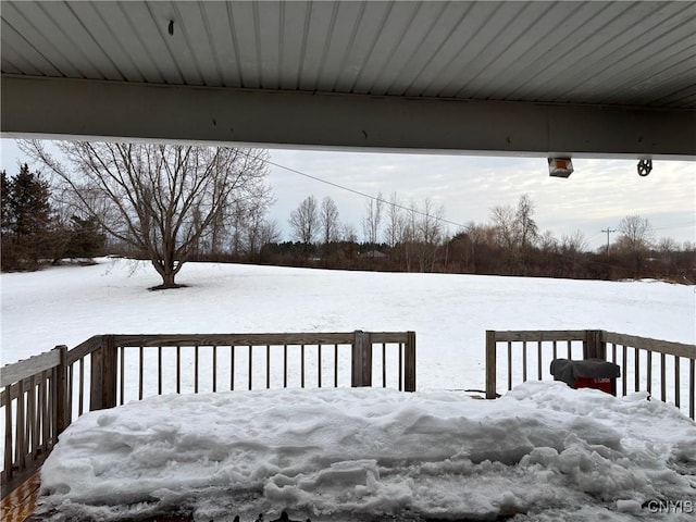 view of snow covered deck