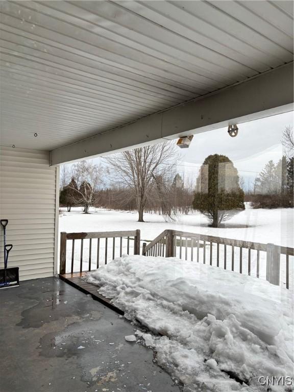 view of snow covered deck