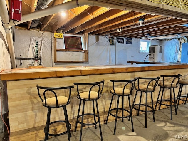 bar with concrete floors and bar area