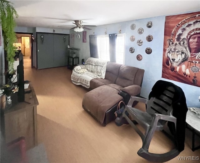 living area featuring ceiling fan