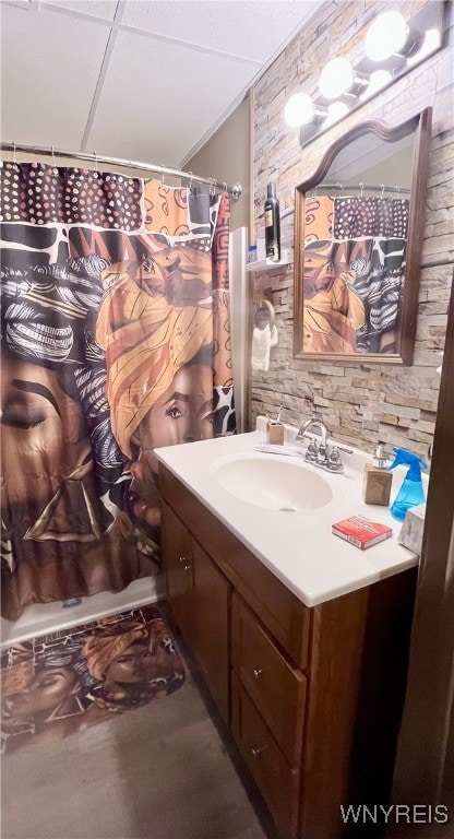 bathroom featuring vanity and a shower with shower curtain