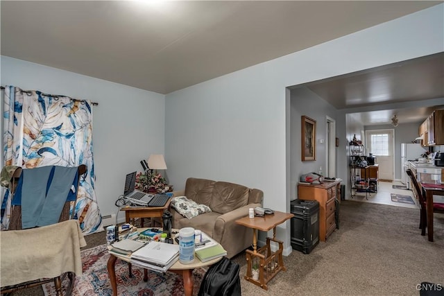 living room featuring carpet floors and baseboard heating