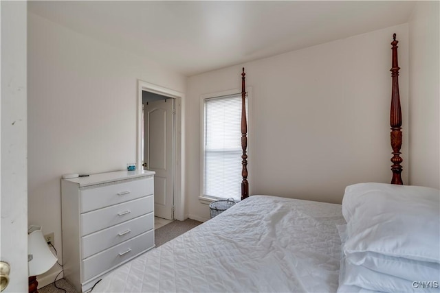 bedroom featuring light colored carpet