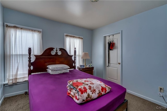 bedroom with carpet flooring and baseboards