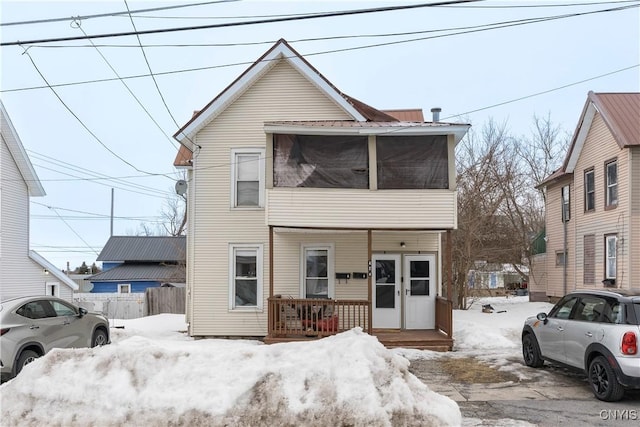 view of front of property featuring french doors and fence