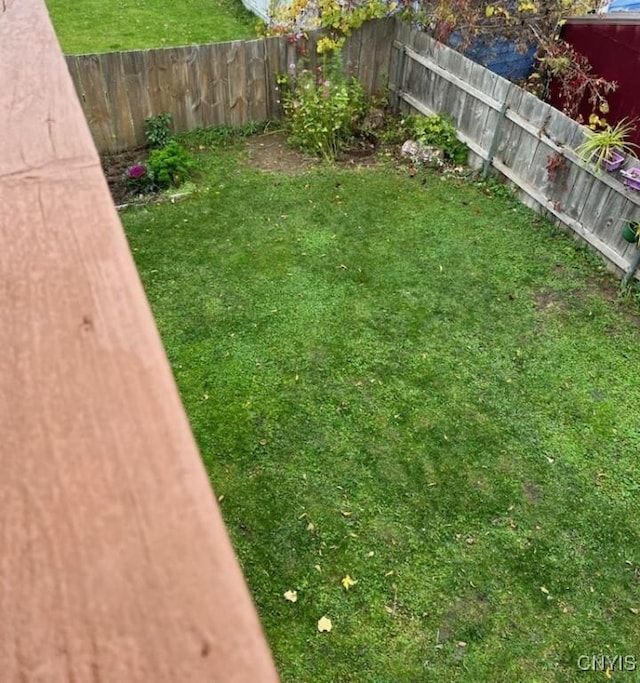 view of yard with a fenced backyard