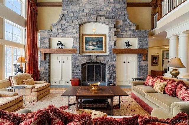 3789 State Route 12, Kirkland, NY 13323 - living area featuring ornamental molding, a fireplace, a high ceiling, and wood finished floors
