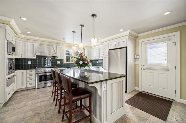 3789 State Route 12, Kirkland, NY 13323 - kitchen featuring premium range hood, a kitchen breakfast bar, appliances with stainless steel finishes, a center island, and a warming drawer