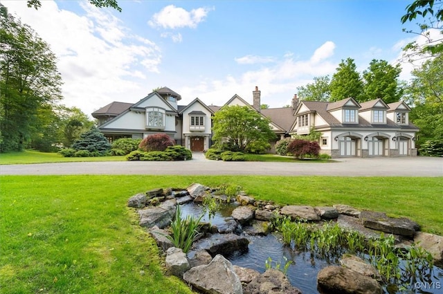 3789 State Route 12, Kirkland, NY 13323 - view of green lawn with a garden pond and curved driveway