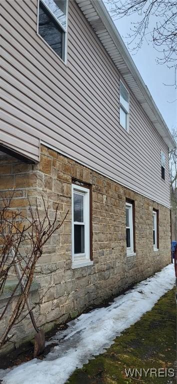 view of home's exterior featuring stone siding