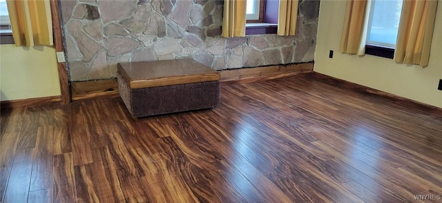 sitting room featuring dark wood-type flooring