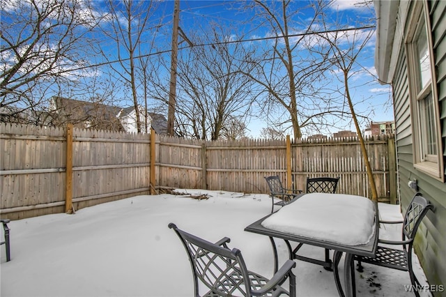 view of yard featuring a patio, outdoor dining area, and a fenced backyard