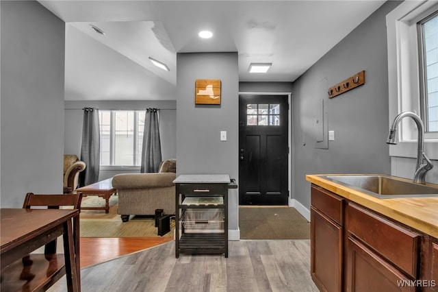 entrance foyer with light wood finished floors and baseboards