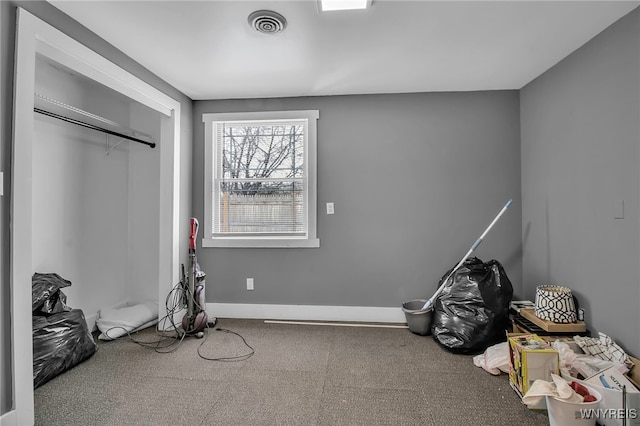 unfurnished bedroom featuring carpet floors, visible vents, and baseboards