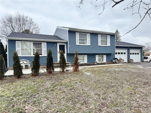 split level home featuring a garage