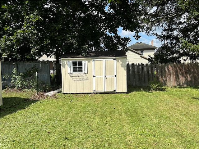 view of shed featuring a fenced backyard