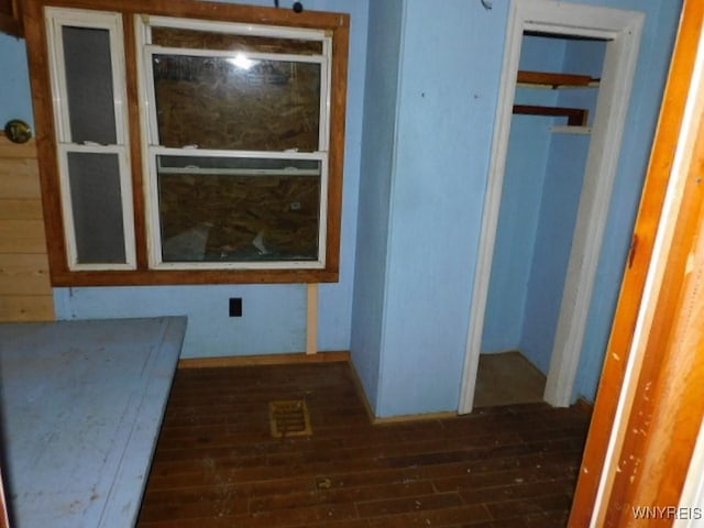 hallway featuring dark wood-style floors